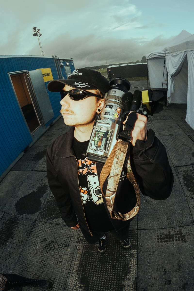Lari Lähde backstage with camera gear